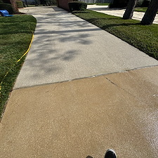 Driveway-Sidewalk-Cleaning-and-House-Wash-Equals-Complete-Exterior-Cleaning-Transformation-at-Deerwood-Country-Club-Jacksonville-FL 1